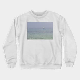 Paddle boarder in the sea off the Isle of Herm, Channel Islands Crewneck Sweatshirt